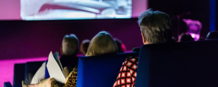 Auditorium at Towner, Eastbourne. And audience sits, watching the screen