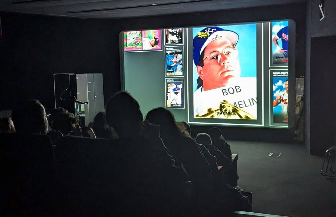 Ecstatic Truths screening of The Bob Emergency. A dark cinema with the film playing on-screen.